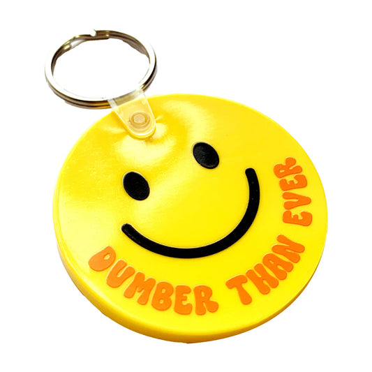 Dumber Than Ever Happy Face Round Yellow Vinyl Keychain